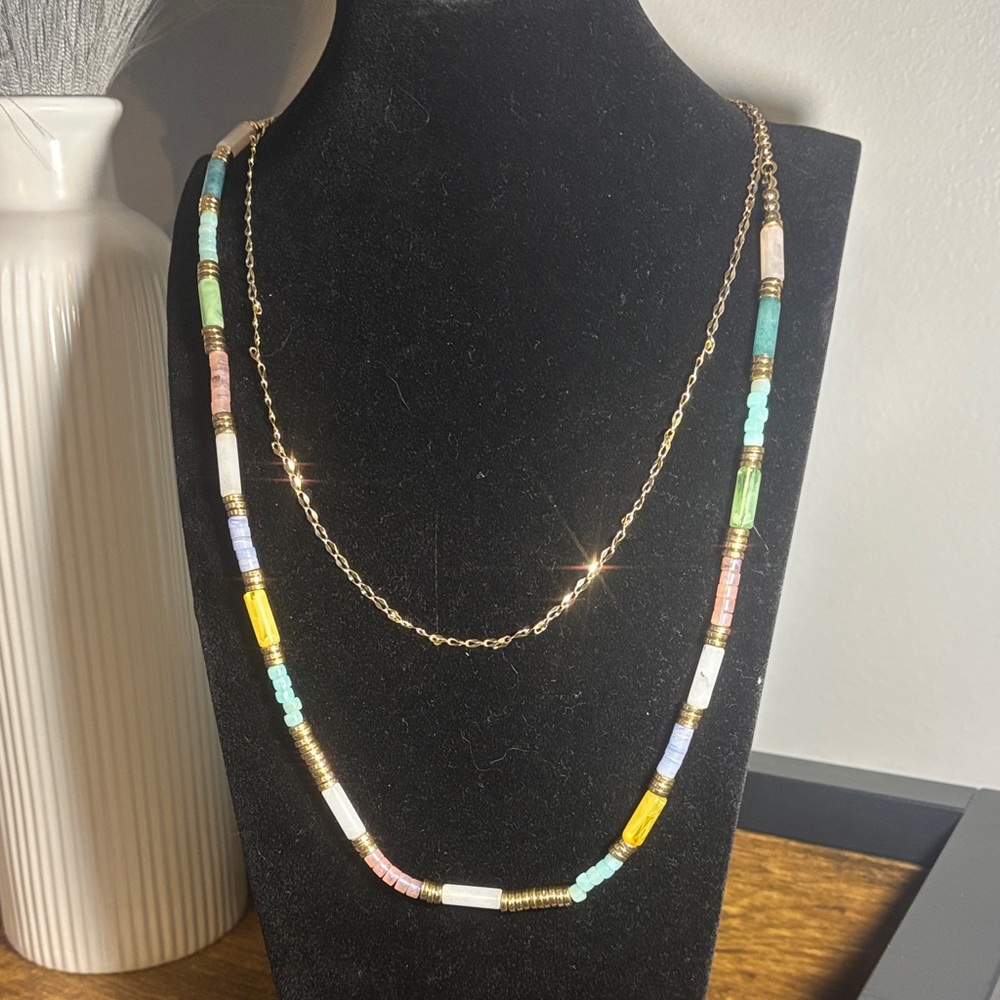 New double strand gold beaded necklace. Very colorful and never worn.